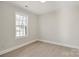 Bright bedroom featuring wood-look floors, a window with natural light and white walls at 141 Ark St, Kings Mountain, NC 28086
