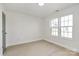 Well lit bedroom featuring wood-look floors and two windows for natural light at 141 Ark St, Kings Mountain, NC 28086