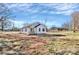 Charming single-Gathering home with a classic white exterior and black trim, surrounded by an expansive yard at 141 Ark St, Kings Mountain, NC 28086