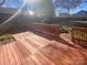 Back deck featuring wood slats, wood railing, and a view of the yard at 14106 Carriage Lake Dr, Charlotte, NC 28273
