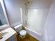 Bathroom featuring a shower-tub combo, toilet, single vanity, mirror, and neutral tones at 14106 Carriage Lake Dr, Charlotte, NC 28273