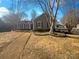 Charming single-story home with gray siding, white trimmed windows, and a cozy well maintained yard at 14106 Carriage Lake Dr, Charlotte, NC 28273