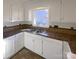 Bright kitchen with white cabinets and stainless steel sink at 14106 Carriage Lake Dr, Charlotte, NC 28273