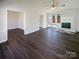 Living room with fireplace, hardwood floors, and access to an outdoor deck at 14106 Carriage Lake Dr, Charlotte, NC 28273