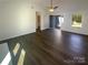 Inviting living room with hardwood floors, open entryway and view of front yard at 14106 Carriage Lake Dr, Charlotte, NC 28273