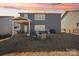 Backyard with covered patio and outdoor seating area, great for outdoor dining and entertaining with lovely sunset backdrop at 1426 Whitman Ct, York, SC 29745