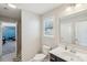 Bright bathroom features a vanity, toilet, and access to a shower at 1426 Whitman Ct, York, SC 29745