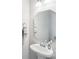 Clean bathroom features a pedestal sink, a sleek mirror, and modern fixtures and towel rack at 1426 Whitman Ct, York, SC 29745