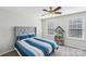 Bright bedroom with a cozy bed, a bookcase, and two windows for natural light at 1426 Whitman Ct, York, SC 29745