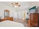 Spacious bedroom with a dresser, television, and an ensuite bathroom at 1426 Whitman Ct, York, SC 29745