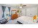 Bedroom with ceiling fan, dresser, and closet offers comfortable living space at 1426 Whitman Ct, York, SC 29745