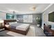 Staged bedroom featuring a gray wall with a bed, TV and white rug at 1426 Whitman Ct, York, SC 29745