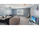 Modern bedroom featuring a large beanbag, stylish chair, and a tv on a white table at 1426 Whitman Ct, York, SC 29745