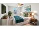 Comfortable bedroom with a ceiling fan, bedside tables and an art piece above the headboard at 1426 Whitman Ct, York, SC 29745