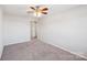 Bright bedroom features neutral walls, carpet, and ceiling fan with light fixture at 1426 Whitman Ct, York, SC 29745