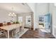 Bright dining room featuring hardwood floors, stylish chandelier, and view of the front yard at 1426 Whitman Ct, York, SC 29745