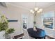 Dining area featuring a modern chandelier, and view to the porch through the glass door at 1426 Whitman Ct, York, SC 29745