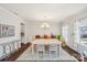 Inviting dining room with hardwood floors, a chandelier, and large windows at 1426 Whitman Ct, York, SC 29745