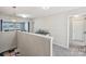 Upstairs hallway leads to a large living space with a contemporary pendant light at 1426 Whitman Ct, York, SC 29745