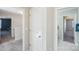 Hallway with three entryways featuring carpeted floors and a closet for storage at 1426 Whitman Ct, York, SC 29745
