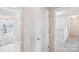Bright hallway featuring neutral paint and flooring and an additional linen closet at 1426 Whitman Ct, York, SC 29745