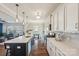 Modern kitchen featuring an island with seating, stainless steel appliances, and ample counter space at 1426 Whitman Ct, York, SC 29745
