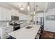 Bright kitchen boasts a large island, stainless steel appliances, and stylish pendant lighting at 1426 Whitman Ct, York, SC 29745