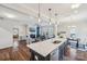 Spacious kitchen with a large island, stainless steel sink, and an open view of the living area at 1426 Whitman Ct, York, SC 29745