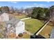Aerial view of a home featuring a spacious backyard, a white fence, and surrounding trees at 159 Creekwood Dr, Mooresville, NC 28117