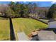 Large fenced backyard with lush green grass and a patio area, perfect for outdoor activities and relaxation at 159 Creekwood Dr, Mooresville, NC 28117