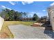 Expansive backyard featuring a gravel area, patio, and lush lawn at 159 Creekwood Dr, Mooresville, NC 28117