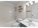 Cozy bathroom featuring a tub, commode, vanity, and decorative wall shelving at 159 Creekwood Dr, Mooresville, NC 28117