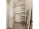 Walk-in closet features built-in shelving units, offering ample storage space at 159 Creekwood Dr, Mooresville, NC 28117