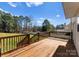 A spacious wooden deck overlooking a large, lush green backyard, perfect for outdoor entertaining at 159 Creekwood Dr, Mooresville, NC 28117