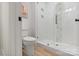 Clean bathroom with tile shower, glass door, and modern fixtures next to a toilet at 16112 Terry Ln, Huntersville, NC 28078