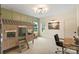 Bright bedroom featuring paneling detail, a playhouse bunk bed and dedicated study area at 16112 Terry Ln, Huntersville, NC 28078