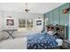 Charming bedroom with unique lighting, decor, and a large window with a pleasant view at 16112 Terry Ln, Huntersville, NC 28078