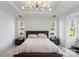 Serene bedroom with natural light, tray ceiling, and classic decor at 16112 Terry Ln, Huntersville, NC 28078