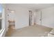 Spacious bedroom with light-colored walls, carpeted floors, and access to an en-suite bathroom at 16112 Terry Ln, Huntersville, NC 28078