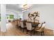 Formal dining room featuring a large table, stylish seating, and view of the home's living spaces at 16112 Terry Ln, Huntersville, NC 28078