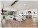 Open-concept living room seamlessly connects to kitchen, offering ample space for entertaining at 16112 Terry Ln, Huntersville, NC 28078