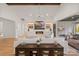 Spacious living room featuring vaulted ceiling, fireplace, and access to outdoor patio at 16112 Terry Ln, Huntersville, NC 28078