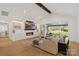 Bright, open living room with fireplace and large sliding glass doors to outdoor patio at 16112 Terry Ln, Huntersville, NC 28078