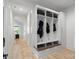 Inviting mudroom with custom storage lockers, bench seating, and easy access to the hallway at 16112 Terry Ln, Huntersville, NC 28078