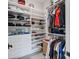 Functional walk-in closet with built-in shelves, drawers, and ample hanging space for organizing clothes at 16112 Terry Ln, Huntersville, NC 28078