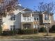 Charming condo with balcony, landscaped yard, and brick and siding exterior at 16614 Amberside E Rd, Cornelius, NC 28031