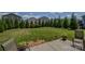 A spacious backyard with lush green grass, surrounded by privacy trees, with room for outdoor activities at 173 Glastonbury Dr, Mooresville, NC 28115