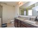 Bathroom with granite double sink vanity, toilet, and glass shower door at 173 Glastonbury Dr, Mooresville, NC 28115