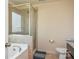 Bathroom with a glass door shower, soaking tub, and neutral tile at 173 Glastonbury Dr, Mooresville, NC 28115