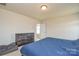 Spacious bedroom featuring neutral walls, carpet, and a rustic dresser with natural light at 173 Glastonbury Dr, Mooresville, NC 28115